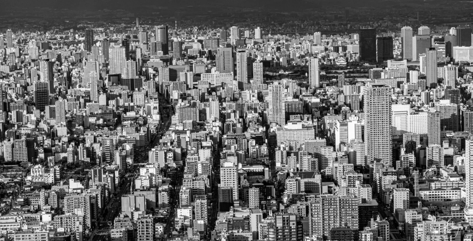 A large, dense city seen from above, in black and white